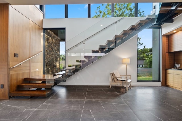 3500 Cactus Wren Way, Austin, TX 78746 - stairs featuring plenty of natural light and baseboards