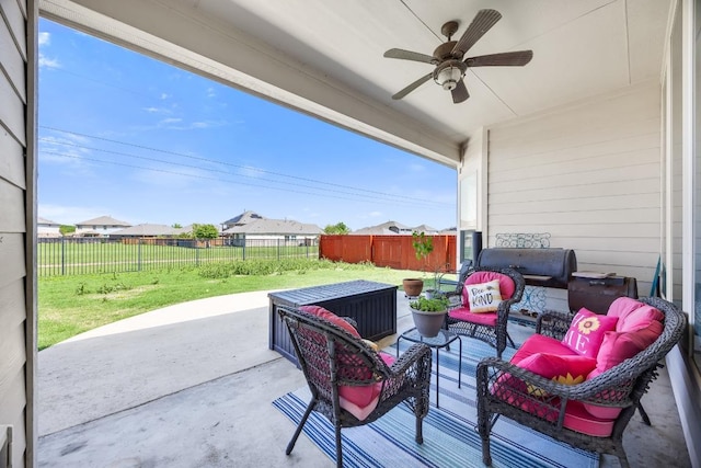 view of patio / terrace featuring a ceiling fan and an outdoor living space