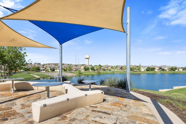 surrounding community featuring a residential view and a water view