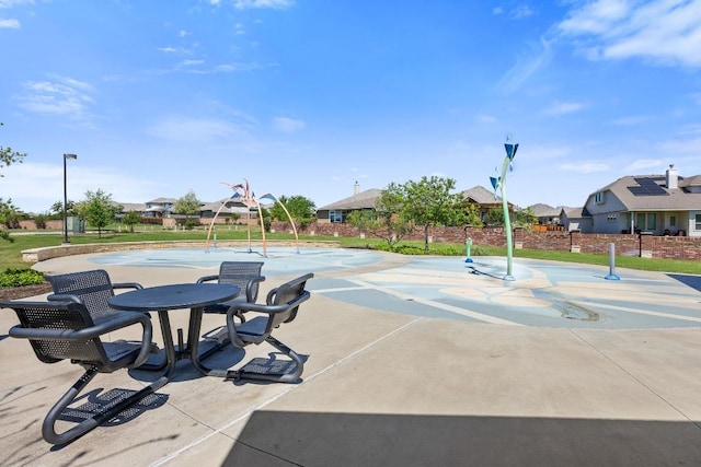view of sport court featuring a residential view