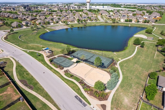 view of property location with a large body of water and nearby suburban area