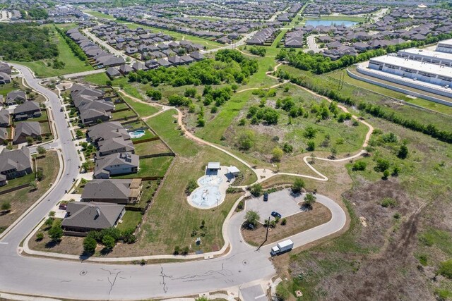 view of property location featuring nearby suburban area and a nearby body of water
