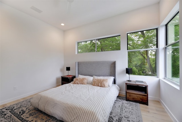 2312 Enfield Rd Unit 2, Austin, TX 78703 - bedroom with multiple windows, light wood-style floors, and recessed lighting