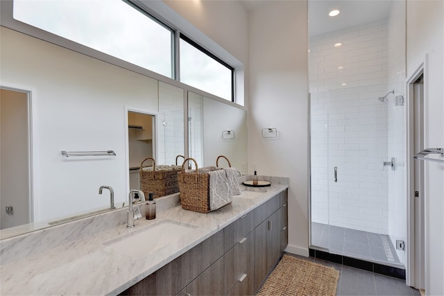 2312 Enfield Rd Unit 2, Austin, TX 78703 - full bathroom with a shower stall, double vanity, tile patterned flooring, and recessed lighting