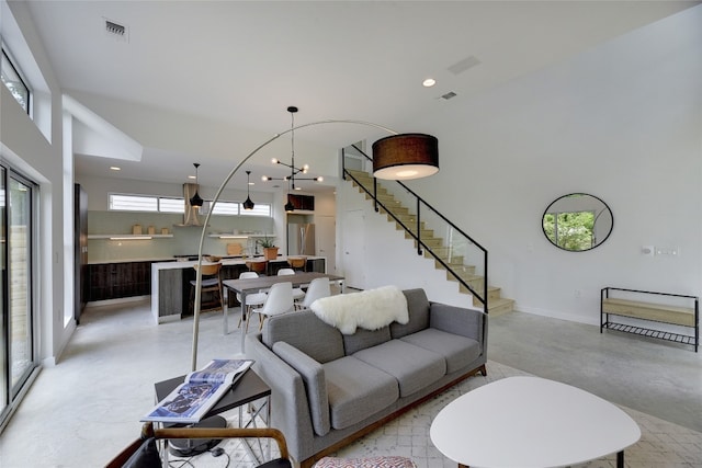 2312 Enfield Rd Unit 2, Austin, TX 78703 - living area featuring concrete floors, stairway, recessed lighting, and baseboards
