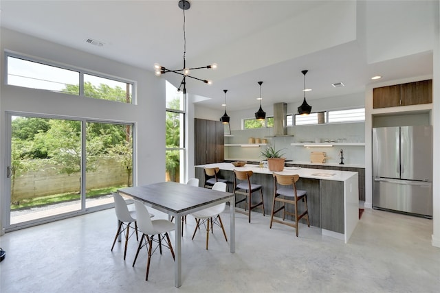 2312 Enfield Rd Unit 2, Austin, TX 78703 - dining space featuring concrete floors, a chandelier, and recessed lighting