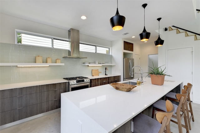 2312 Enfield Rd Unit 2, Austin, TX 78703 - kitchen featuring appliances with stainless steel finishes, island range hood, modern cabinets, an island with sink, and light countertops