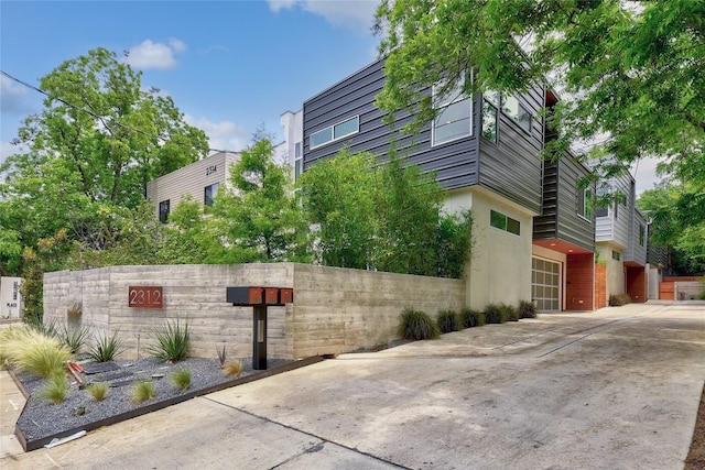 2312 Enfield Rd Unit 2, Austin, TX 78703 - view of side of home featuring driveway and stucco siding