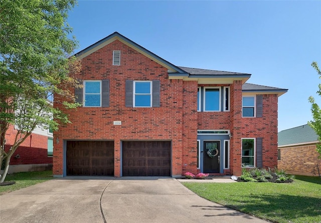 2204 Rick Whinery Dr, Austin, TX 78728 - view of front of house with driveway, an attached garage, brick siding, and a front lawn