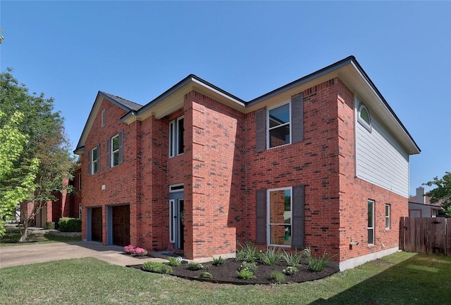 2204 Rick Whinery Dr, Austin, TX 78728 - view of side of home with brick siding, concrete driveway, and an attached garage