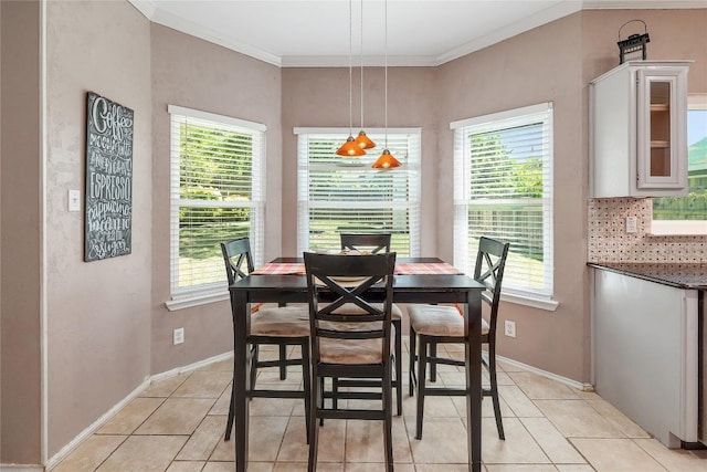 2204 Rick Whinery Dr, Austin, TX 78728 - dining area featuring light tile patterned flooring and crown molding