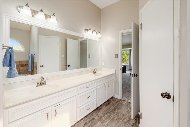2204 Rick Whinery Dr, Austin, TX 78728 - full bathroom featuring double vanity and wood finished floors