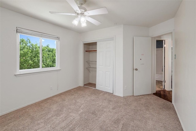 2204 Rick Whinery Dr, Austin, TX 78728 - unfurnished bedroom featuring carpet flooring, a closet, baseboards, and a ceiling fan