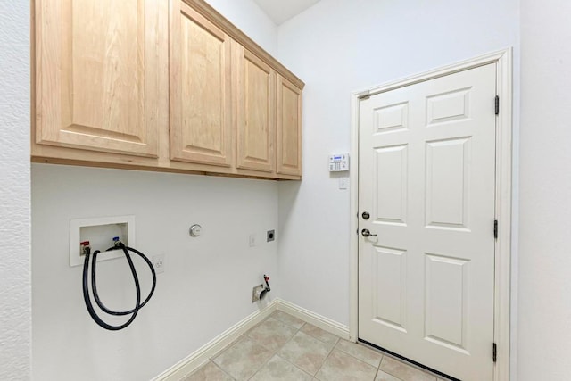 2709 Quiet Moon Trl, Cedar Park, TX 78613 - laundry area featuring hookup for a gas dryer, cabinet space, hookup for a washing machine, baseboards, and light tile patterned flooring