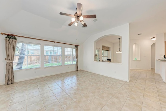 2709 Quiet Moon Trl, Cedar Park, TX 78613 - spare room featuring ceiling fan, vaulted ceiling, arched walkways, light tile patterned flooring, and baseboards