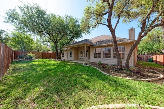 2709 Quiet Moon Trl, Cedar Park, TX 78613 - rear view of property with a chimney
