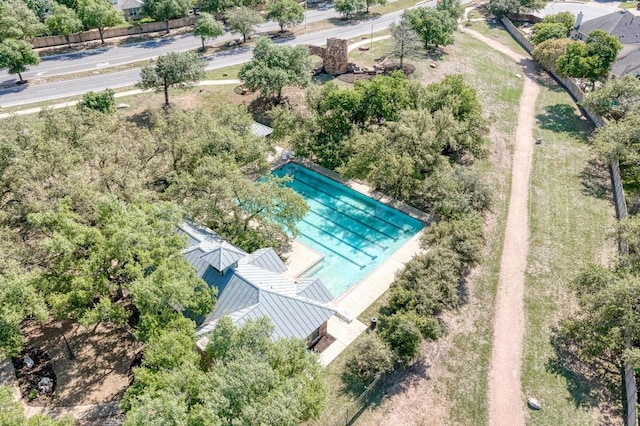 2709 Quiet Moon Trl, Cedar Park, TX 78613 - aerial view of a pool area and a tree filled landscape
