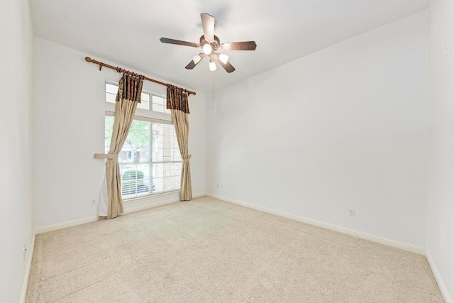 2709 Quiet Moon Trl, Cedar Park, TX 78613 - empty room featuring light colored carpet, a ceiling fan, and baseboards