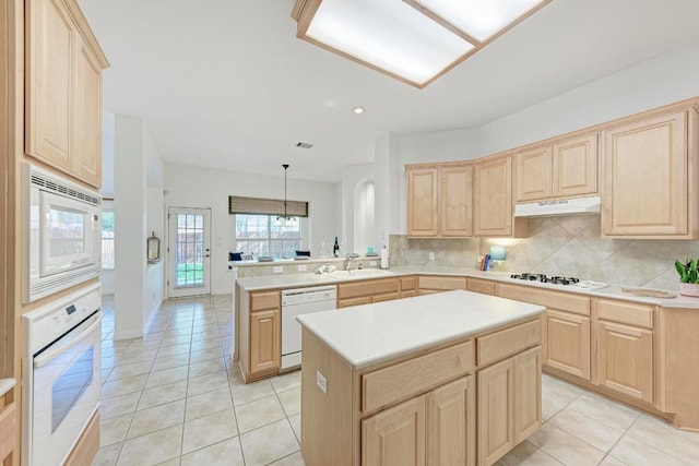 2709 Quiet Moon Trl, Cedar Park, TX 78613 - kitchen featuring light brown cabinets, white appliances, and recessed lighting