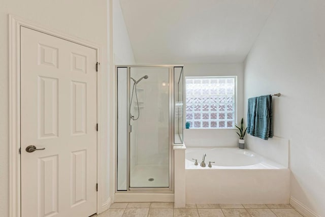 2709 Quiet Moon Trl, Cedar Park, TX 78613 - full bath featuring a shower stall, a garden tub, tile patterned floors, baseboards, and lofted ceiling
