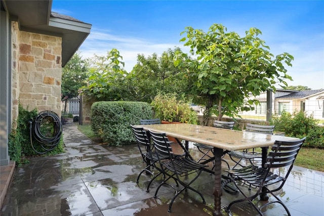 20000 Columbus Ln, Lago Vista, TX 78645 - view of patio / terrace featuring a gate and outdoor dining space