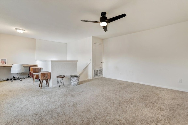 14209 Jeannette Rankin Rd, Manor, TX 78653 - spare room with carpet floors, ceiling fan, an office area, and baseboards