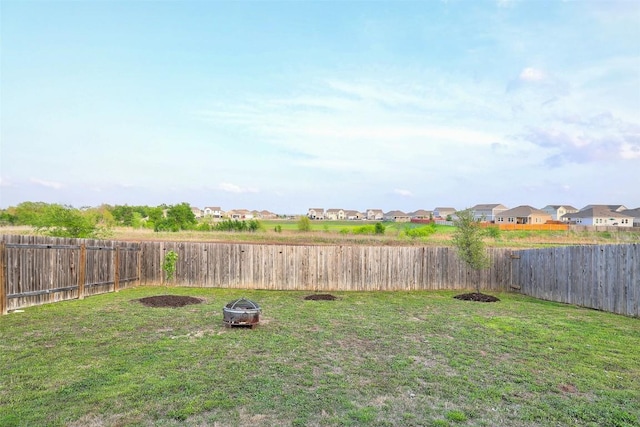 14209 Jeannette Rankin Rd, Manor, TX 78653 - view of yard featuring an outdoor fire pit and a residential view