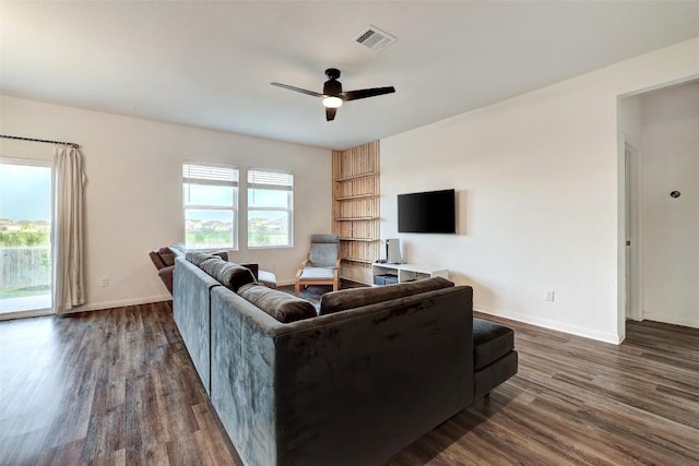 14209 Jeannette Rankin Rd, Manor, TX 78653 - living room featuring dark wood finished floors, ceiling fan, and baseboards