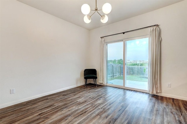 14209 Jeannette Rankin Rd, Manor, TX 78653 - empty room featuring a chandelier, dark wood-style flooring, and baseboards