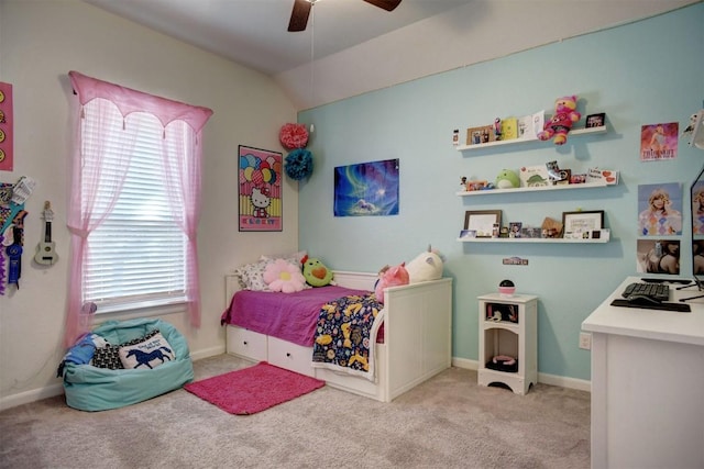 bedroom with baseboards, light colored carpet, ceiling fan, and lofted ceiling