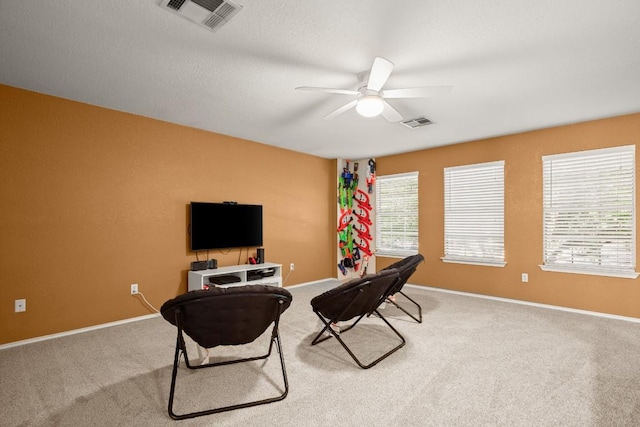12305 Kelton Dr, Austin, TX 78754 - sitting room with a ceiling fan and carpet floors
