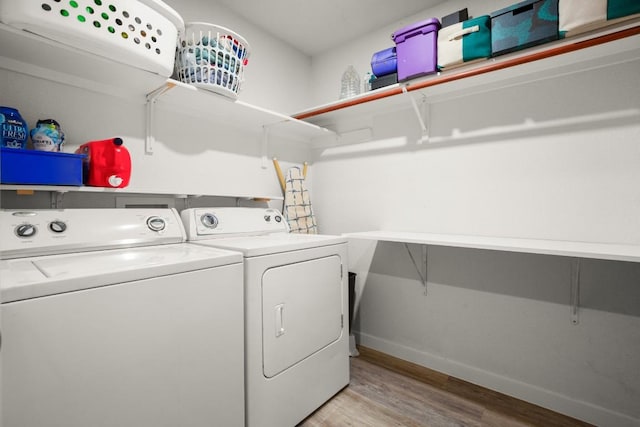 12305 Kelton Dr, Austin, TX 78754 - washroom featuring light wood-style floors and washer and clothes dryer