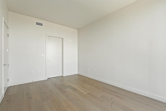 44 E Ave Unit 4302, Austin, TX 78701 - unfurnished bedroom with light wood finished floors and baseboards