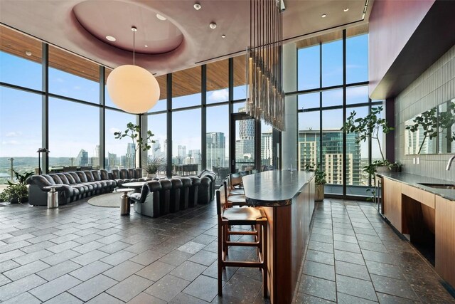 44 E Ave Unit 4302, Austin, TX 78701 - community lobby with expansive windows, a skyline view, a towering ceiling, and recessed lighting