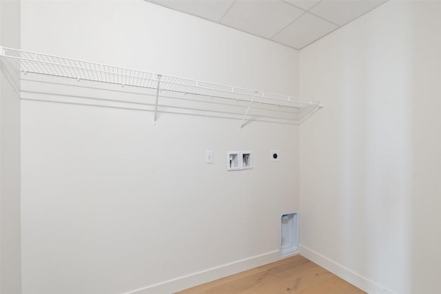 44 E Ave Unit 4302, Austin, TX 78701 - laundry area with electric dryer hookup, washer hookup, and light wood finished floors