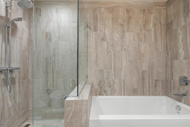 44 E Ave Unit 4302, Austin, TX 78701 - bathroom featuring tiled shower and a bath