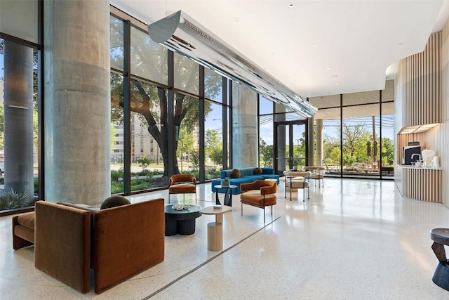 44 E Ave Unit 2307, Austin, TX 78701 - lobby featuring a wall of windows and a towering ceiling