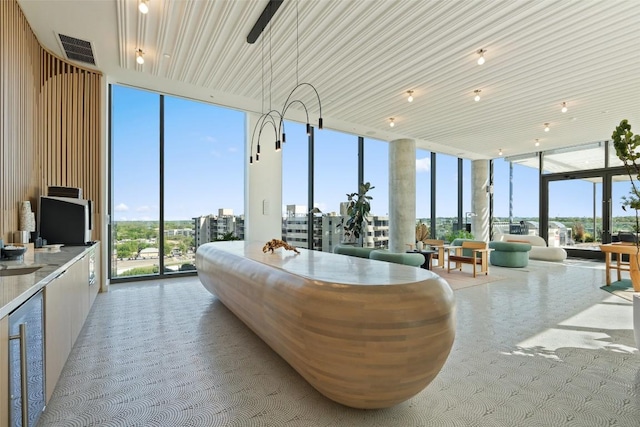 44 E Ave Unit 2307, Austin, TX 78701 - sunroom with plenty of natural light and beverage cooler