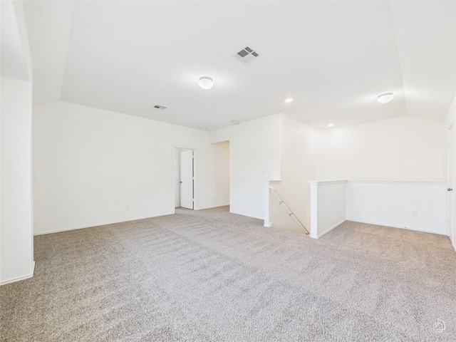 3113 Windy Vane Dr, Pflugerville, TX 78660 - unfurnished room featuring light carpet, vaulted ceiling, baseboards, and recessed lighting