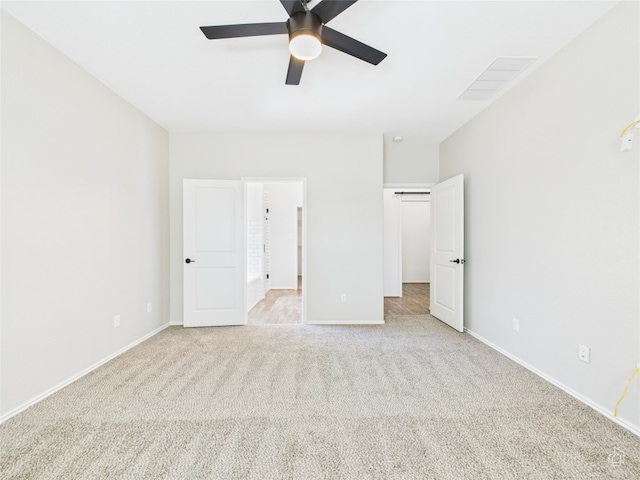3113 Windy Vane Dr, Pflugerville, TX 78660 - unfurnished bedroom featuring light carpet, baseboards, and ceiling fan