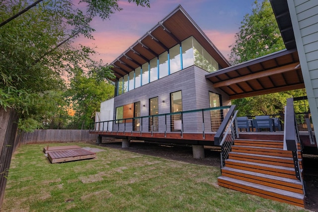 5607 Jim Hogg Ave, Austin, TX 78756 - back of house at dusk featuring a wooden deck