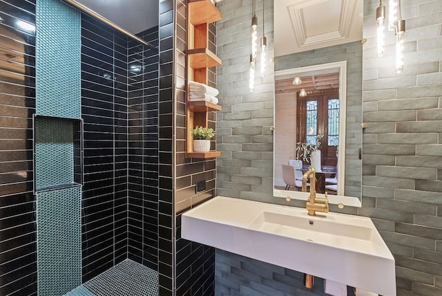5607 Jim Hogg Ave, Austin, TX 78756 - full bathroom with a tile shower, tile walls, and french doors