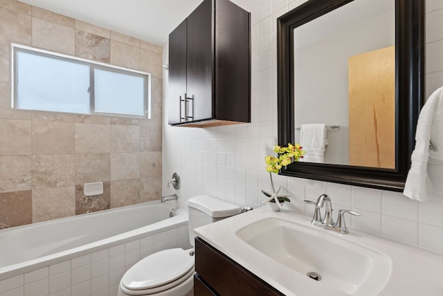 5607 Jim Hogg Ave, Austin, TX 78756 - bathroom featuring tile walls, toilet, vanity, and  shower combination