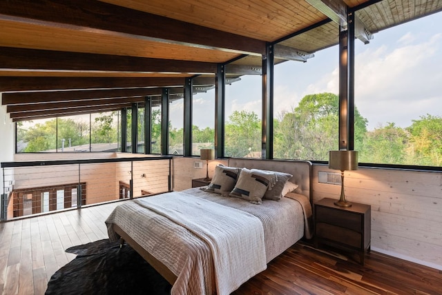 5607 Jim Hogg Ave, Austin, TX 78756 - bedroom featuring beamed ceiling, hardwood / wood-style floors, and wood walls