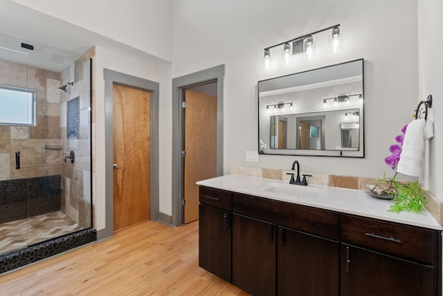 5607 Jim Hogg Ave, Austin, TX 78756 - full bath with a shower stall, wood finished floors, and vanity