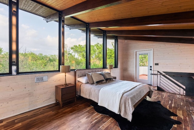 5607 Jim Hogg Ave, Austin, TX 78756 - bedroom featuring beam ceiling, hardwood / wood-style floors, wood walls, and access to outside