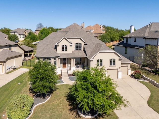 17012 Rush Pea Cir, Austin, TX 78738 - view of front of home featuring concrete driveway, a porch, a residential view, stucco siding, and a shingled roof