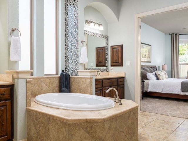 17012 Rush Pea Cir, Austin, TX 78738 - bathroom with vanity, a garden tub, tile patterned floors, and ensuite bathroom