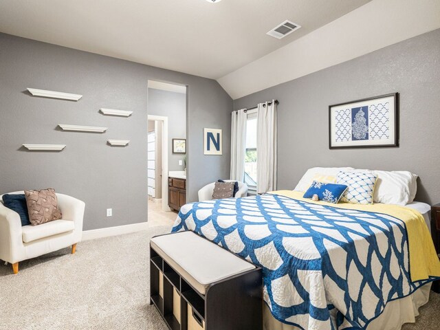 17012 Rush Pea Cir, Austin, TX 78738 - bedroom with lofted ceiling, light carpet, and ensuite bath