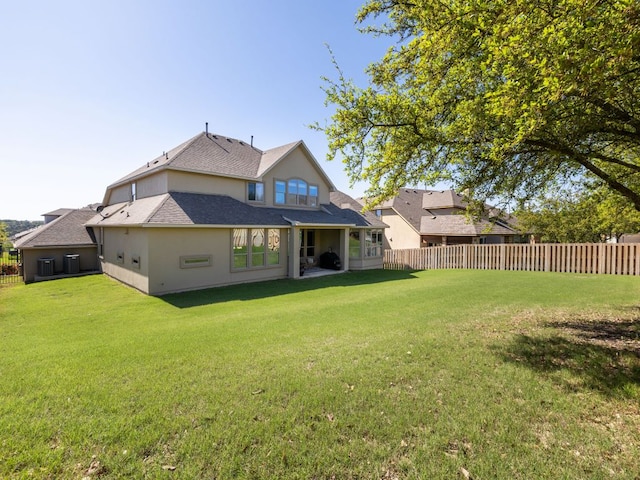 17012 Rush Pea Cir, Austin, TX 78738 - rear view of house with central AC, stucco siding, and a shingled roof